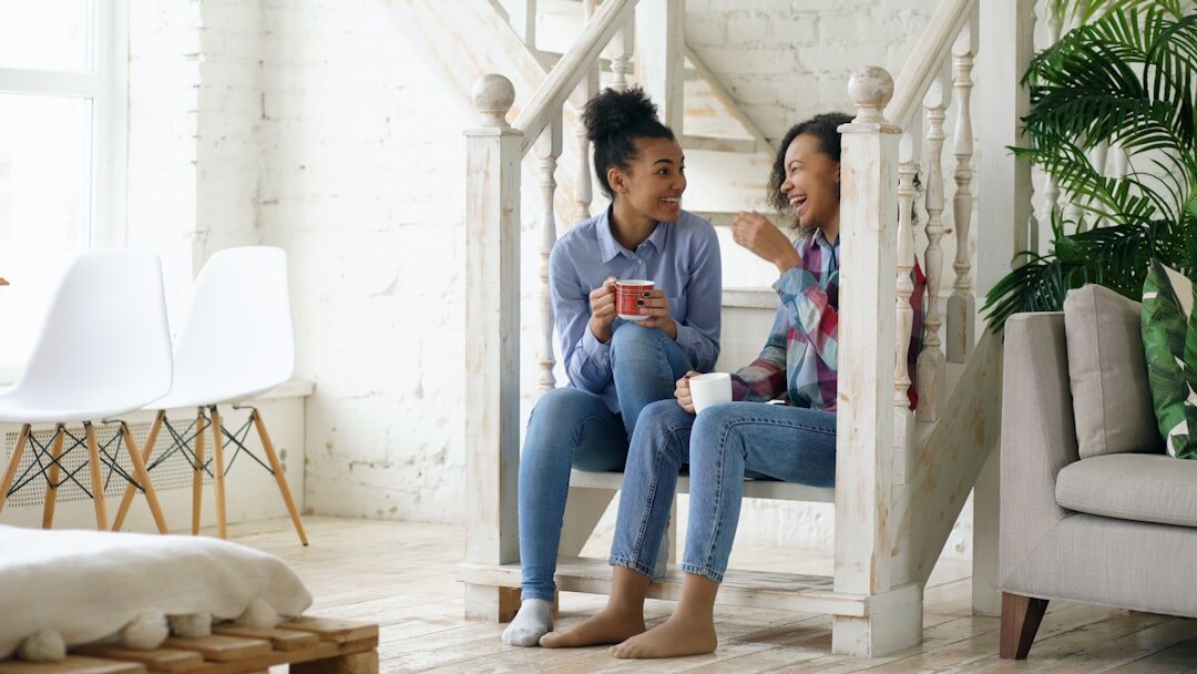Adult daughter talking warmly with her senior mother at home