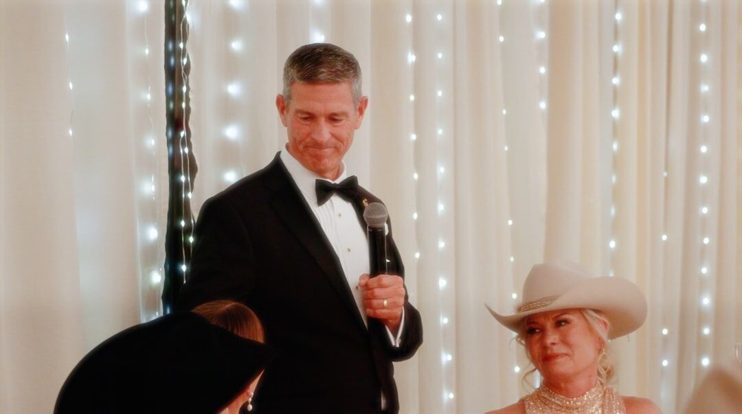 Older couples dancing together in a bright hall