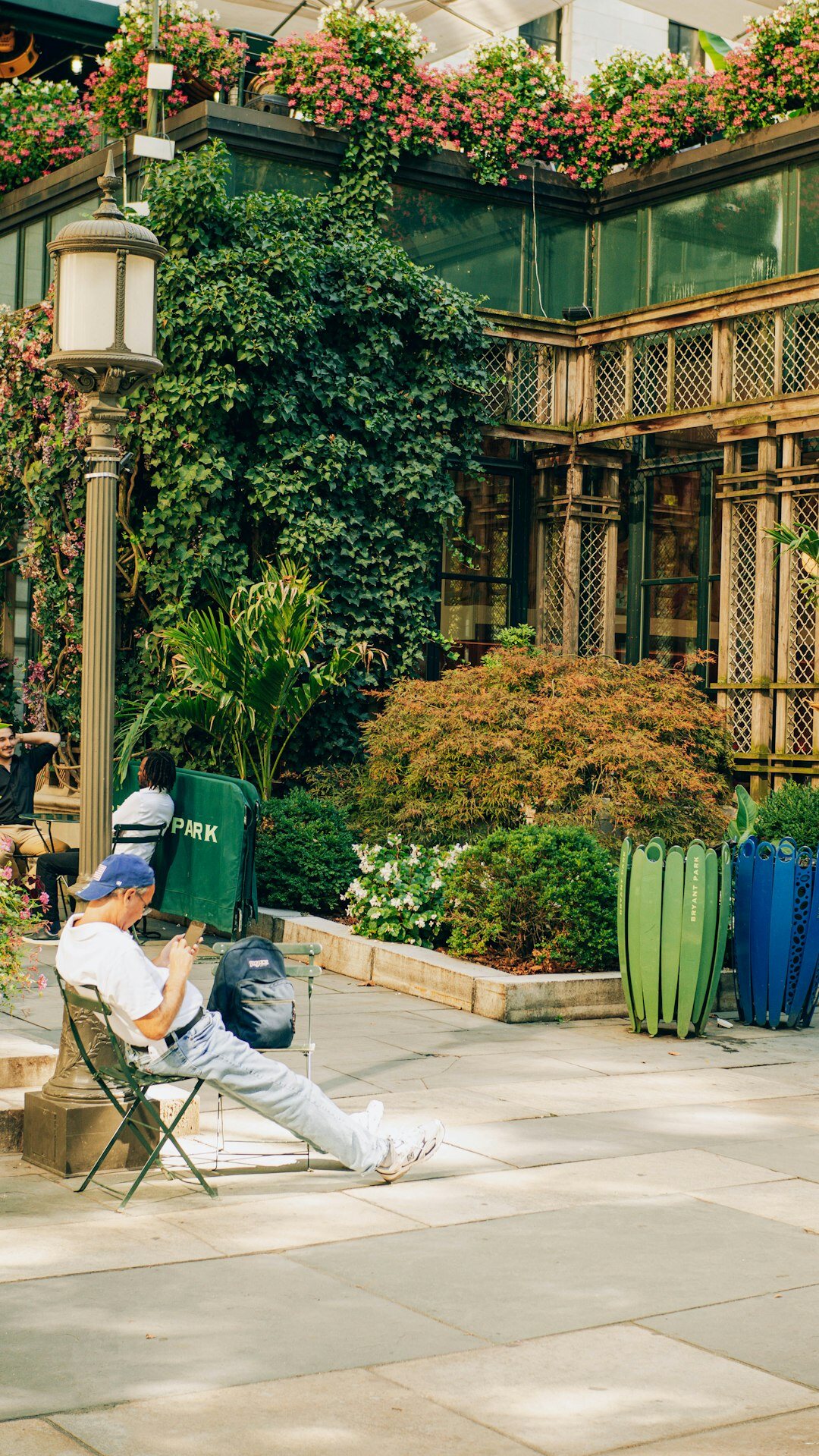 senior man reading book outdoors